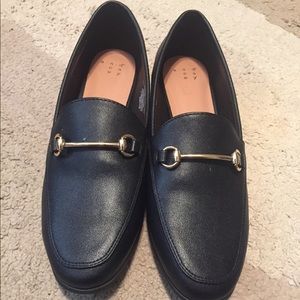 Black and gold flats